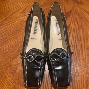 Prada heels with white stitches, silver ornaments